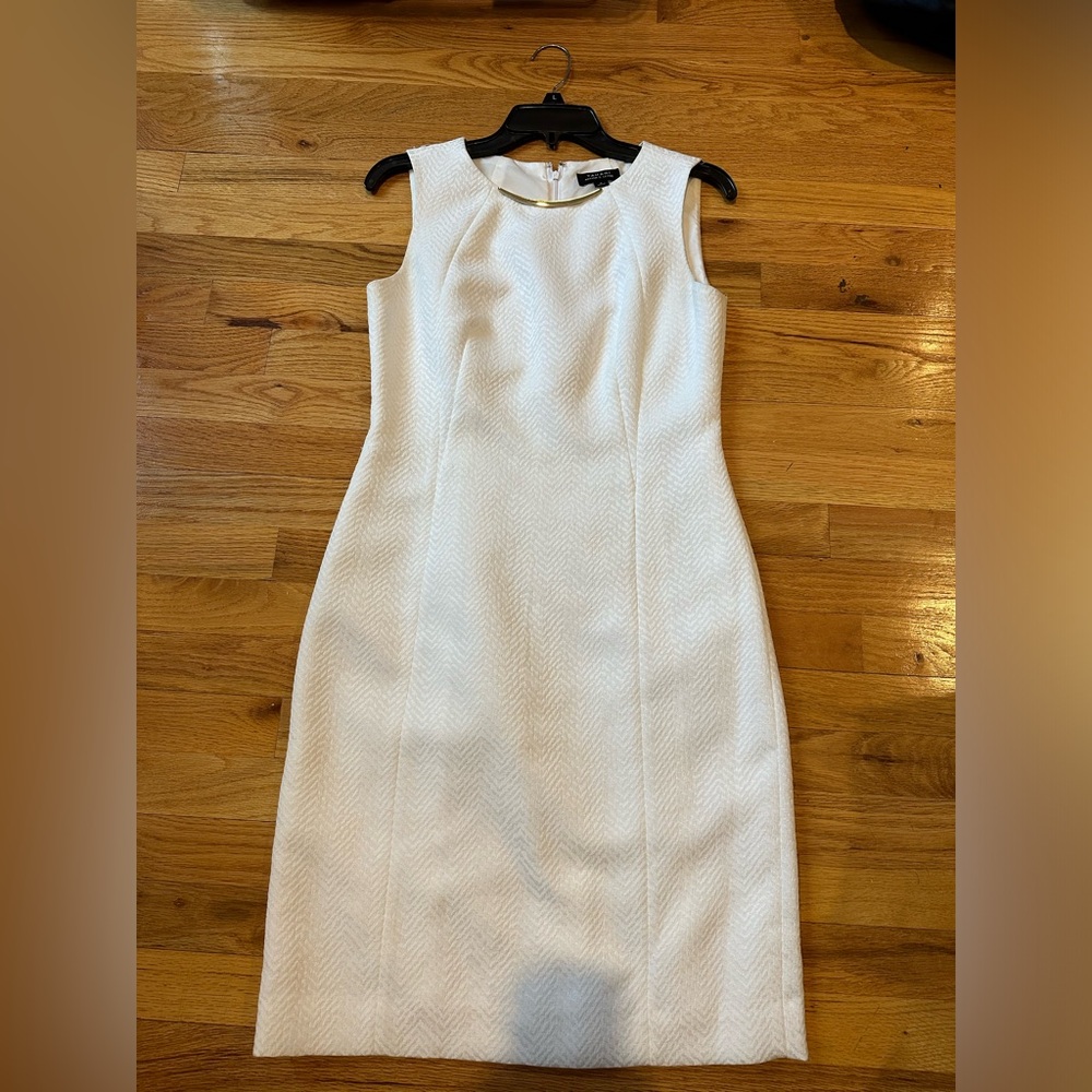 White dress with gold collar